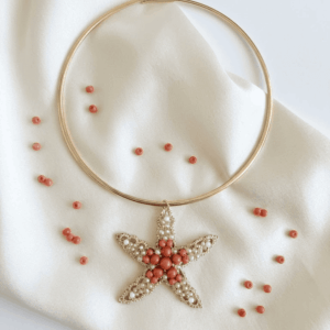 Collana rigida Stella corallo oro